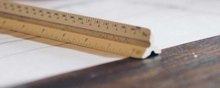 Architectural scale ruler laid on a piece of paper