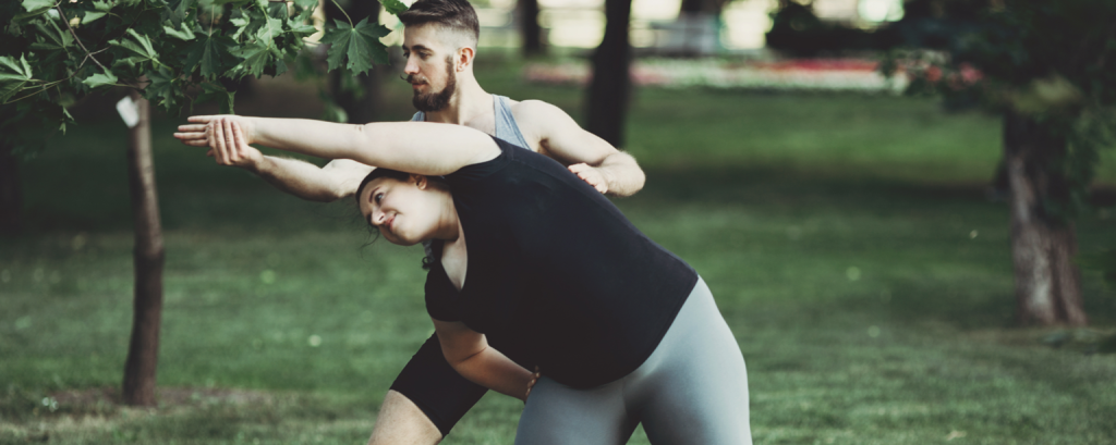 Insured in Georgia yoga instructor teaches a student in a park 

