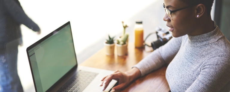 A female digital marketer working on a laptop