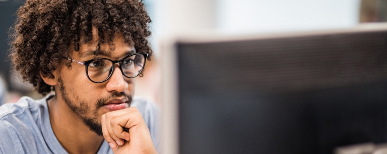 Engineer looking at desktop computer