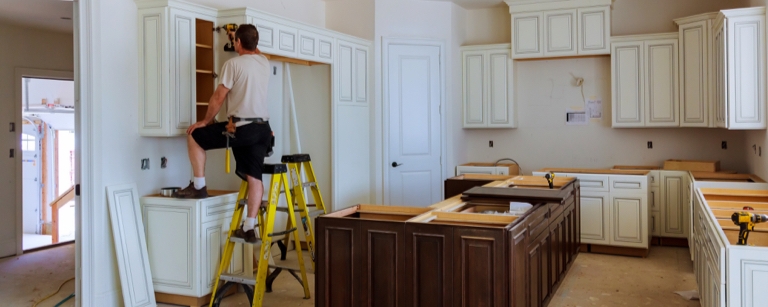 An insured contractor installing a kitchen

