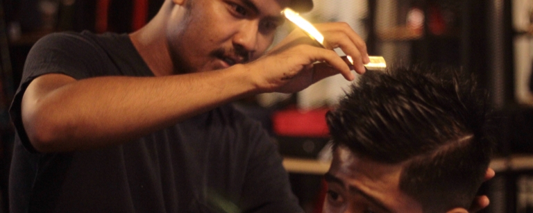 Barber with straight razor