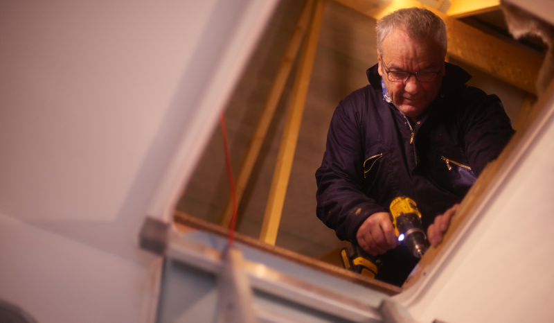 Bonded and insured contractor works in attic.