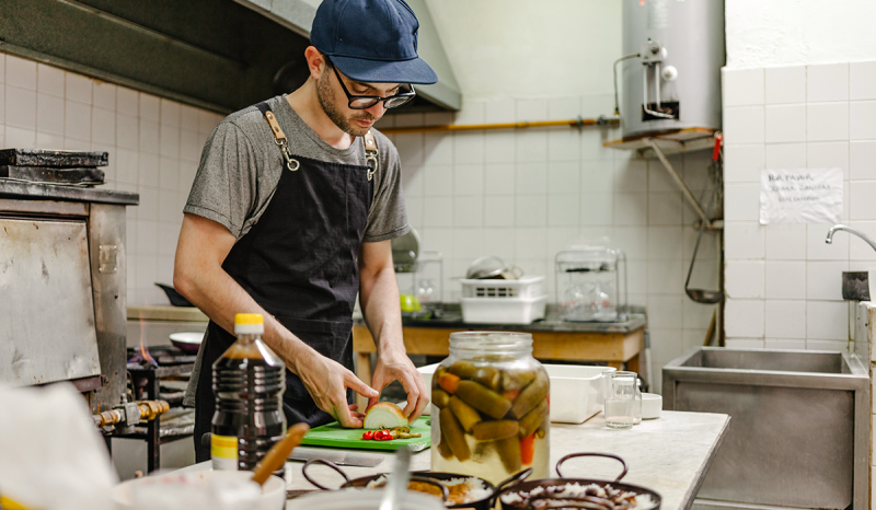 Man preparing food in a commercial kitchen