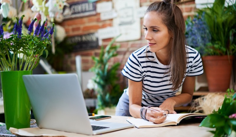 A florist looks up how to get a Utah business license.