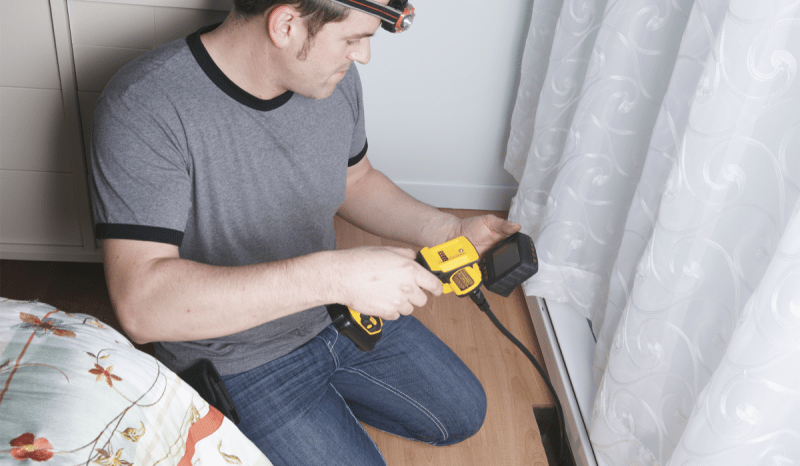 A man working on an HVAC system.