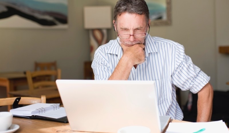 Getting a business bank account means you can have more control over your money, like this entrepreneur at his desk.