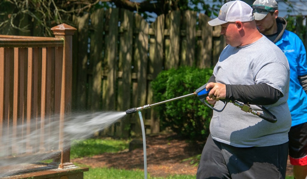 A man learning how to start his own pressure washing business