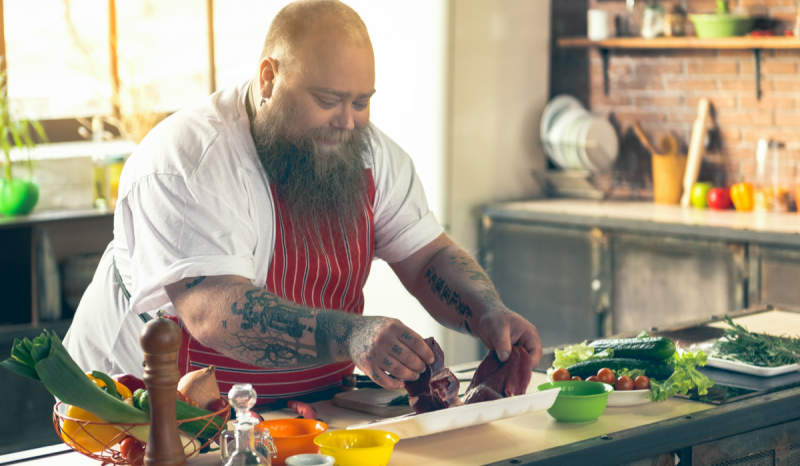 A man preparing food in a home kitchen