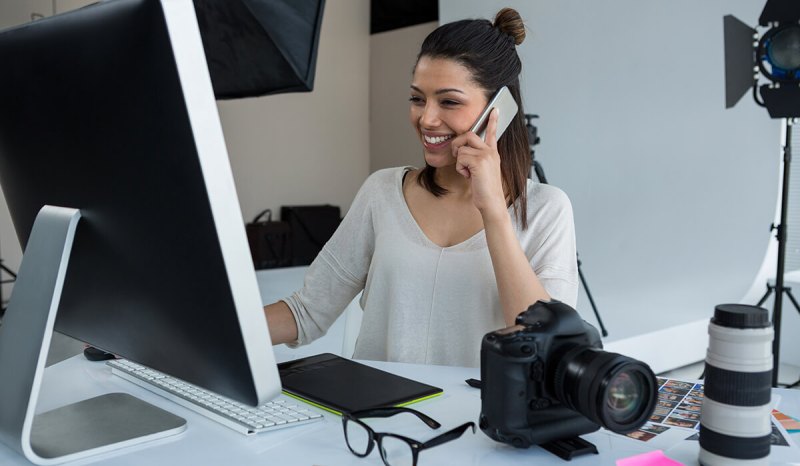 Here's how to make money as a photographer, like this photographer is doing at her studio.