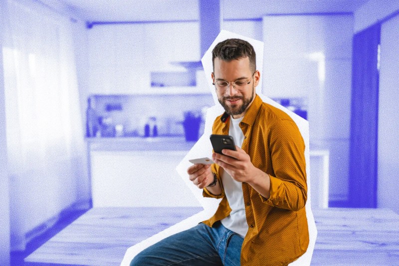 Business owner checking his bank account with a mobile device.