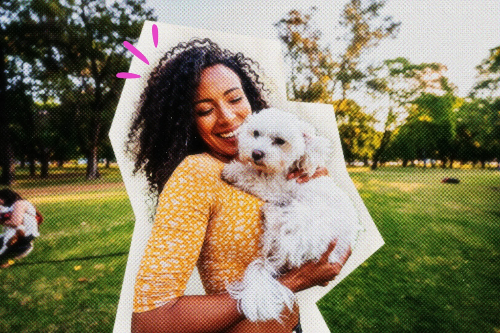 Pet sitter holding a white dog